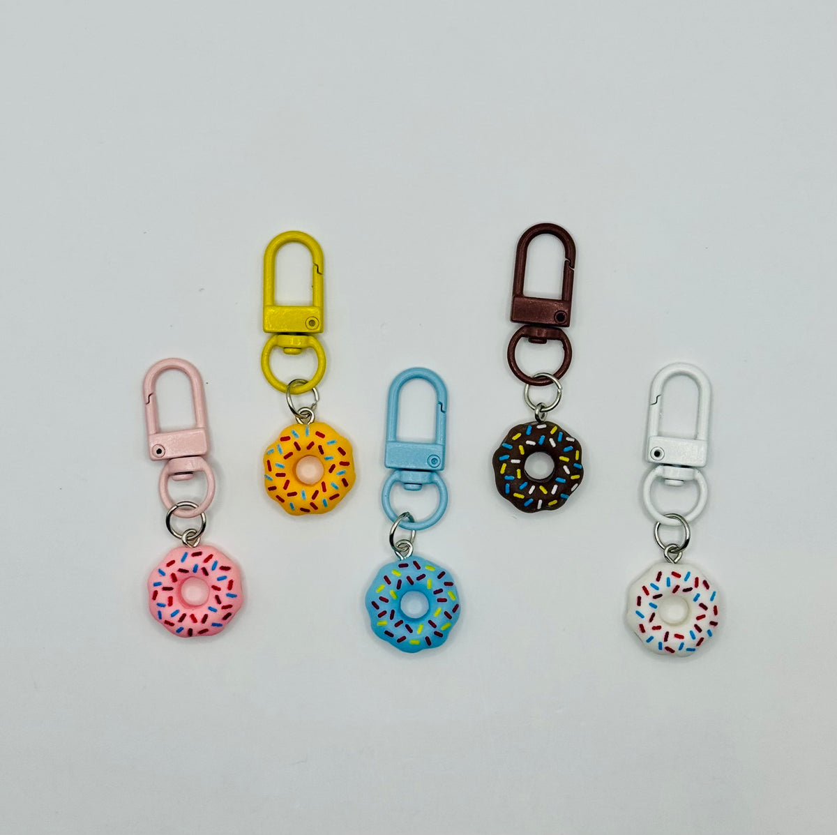 Sprinkle Donut charms in strawberry, sunshine yellow, blueberry, chocolate and vanilla with matching swivel clasps